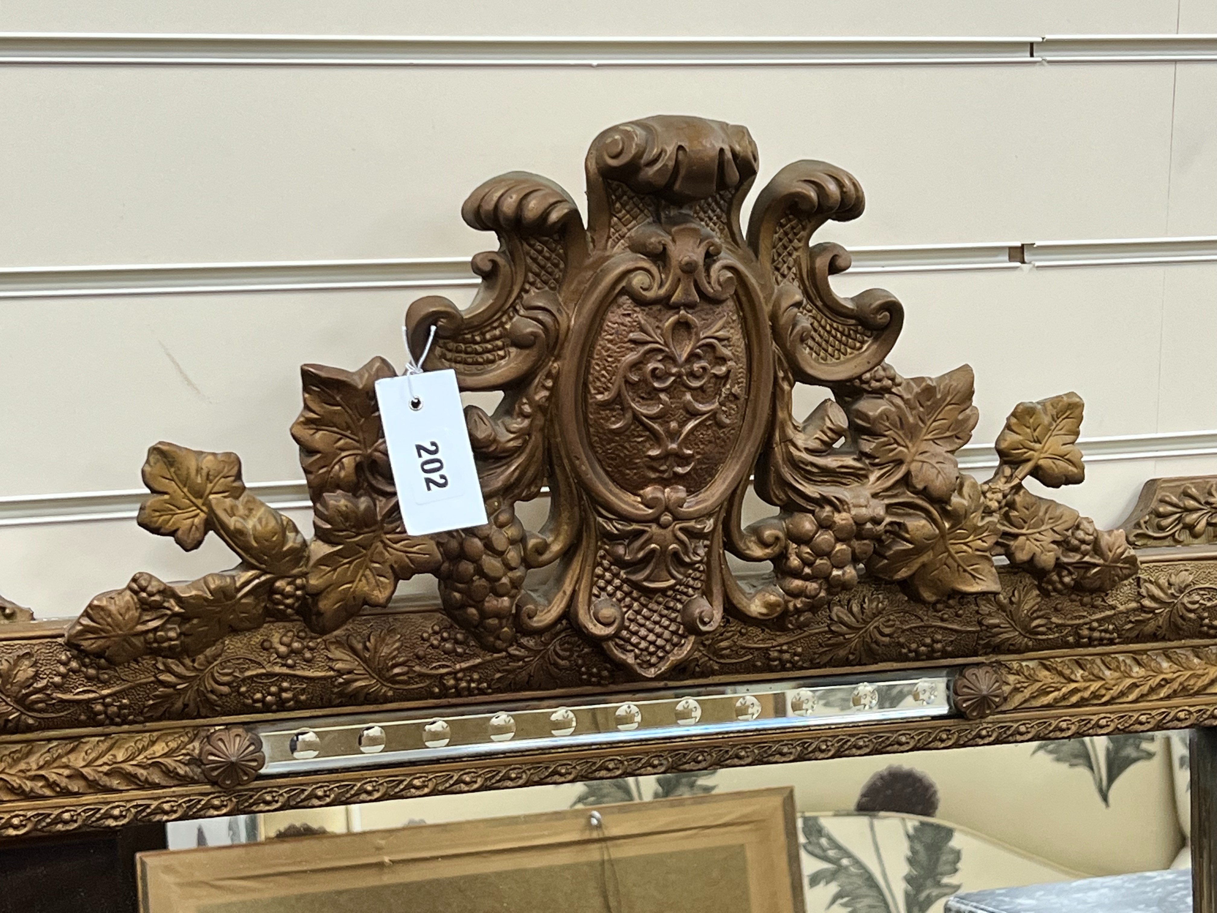 A late 19th century French giltwood and gesso overmantel mirror, with marginal plates, width 90cm height 140cm